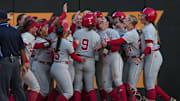 Nebraska's Hannah Camenzind (9) celebrates with teammates after hitting a home run during a NCAA super regional game between Tennessee and Nebraska at Sherri Parker Lee Stadium in Knoxville, Tenn., on May 23, 2025.
