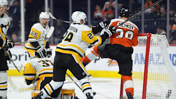 Oct 28, 2025; Philadelphia, Pennsylvania, USA; Pittsburgh Penguins defenseman Parker Wotherspoon (28) hits Philadelphia Flyers right wing Matvei Michkov (39) in the third period at Xfinity Mobile Arena. Mandatory Credit: Kyle Ross-Imagn Images