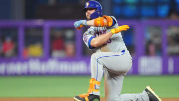 Jul 20, 2024; Miami, Florida, USA;  New York Mets first baseman Pete Alonso (20) kneels on second base after hitting a double against the Miami Marlins in the fourth inning at loanDepot Park. Mandatory Credit: Jim Rassol-USA TODAY Sports