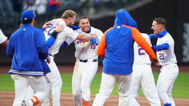 New York Mets first baseman Pete Alonso (20) celebrates with teammates after hitting a walk-off home run against the Detroit Tigers for New York's first win of the season