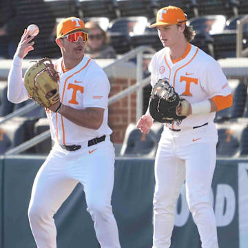 Tennessee first baseman Alberto Osuna (45) tosses the ball up while warming up at the Tennessee baseball season opener against Hofstra, in Lindsey Nelson Stadium at University of Tennessee in Knoxville, Tenn., Friday, February. 14, 2025.
