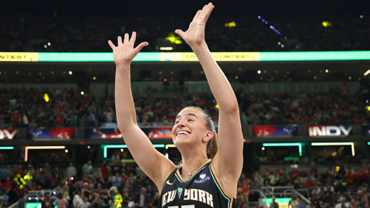 New York Liberty's Sabrina Ionsecu celebrates winning the three-point contest.