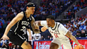 Feb 15, 2025; Oxford, Mississippi, USA; Mississippi Rebels guard Matthew Murrell (11) drives to the basket as Mississippi State Bulldogs guard Riley Kugel (2) defends during the second half at The Sandy and John Black Pavilion at Ole Miss. Mandatory Credit: Petre Thomas-Imagn Images