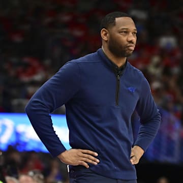 Apr 27, 2024; New Orleans, Louisiana, USA; New Orleans Pelicans head coach Willie Green stands on the court during game three of the first round for the 2024 NBA playoffs against the Oklahoma City Thunder at Smoothie King Center. 