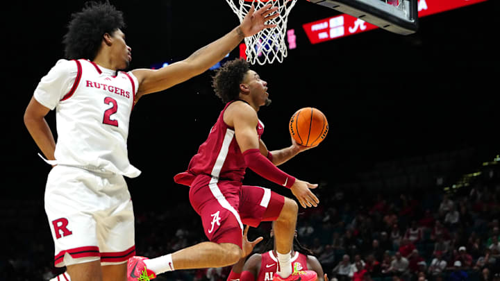 Nov 27, 2024; Las Vegas, Nevada, USA; Alabama Crimson Tide guard Mark Sears (1) shoots inside the defense of Rutgers Scarlet Knights guard Dylan Harper (2) during the second half at MGM Grand Garden Arena. Mandatory Credit: Stephen R. Sylvanie-Imagn Images