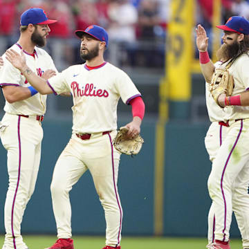 Sep 14, 2024; Philadelphia, Pennsylvania, USA; Philadelphia Phillies first baseman Bryce Harper (3) and center fielder Cal Stevenson (47) celebrate after defeating the New York Mets at Citizens Bank Park.