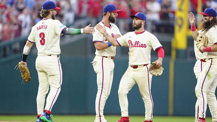 Sep 14, 2024; Philadelphia, Pennsylvania, USA; Philadelphia Phillies first baseman Bryce Harper (3) and center fielder Cal Stevenson (47) celebrate after defeating the New York Mets at Citizens Bank Park.