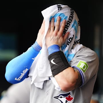 Aug 6, 2025; Denver, Colorado, USA; Toronto Blue Jays catcher Tyler Heineman (55) cools off in the sixth inning against the Colorado Rockies at Coors Field. 