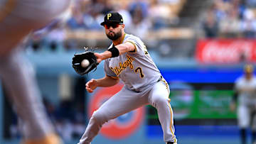 Apr 27, 2025; Los Angeles, California, USA; Pittsburgh Pirates shortstop Isiah Kiner-Falefa (7) makes an out at second during the first inning against the Los Angeles Dodgers at Dodger Stadium. Mandatory Credit: Jonathan Hui-Imagn Images