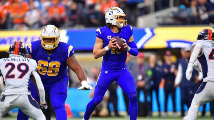 Dec 10, 2023; Inglewood, California, USA; Los Angeles Chargers quarterback Justin Herbert (10) drops back to pass against the Denver Broncos during the first half at SoFi Stadium. Mandatory Credit: Gary A. Vasquez-USA TODAY Sports