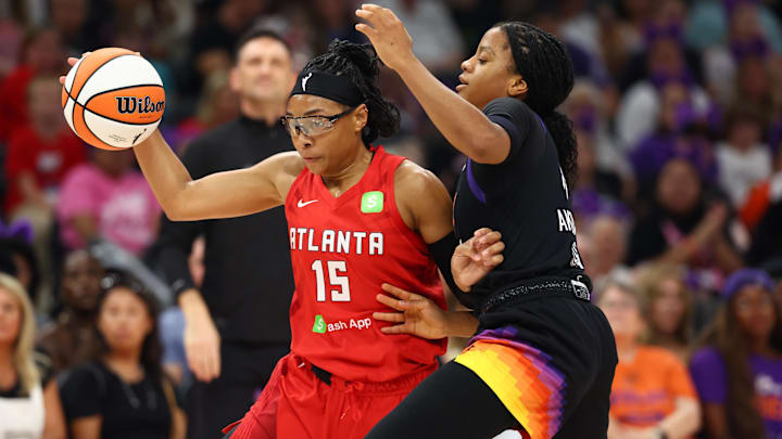 Aug 10, 2025; Phoenix, Arizona, USA; Atlanta Dream guard Allisha Gray (15) moves the ball against Phoenix Mercury guard Monique Akoa Makani (8) in the first half at Footprint Center. Mandatory Credit: Mark J. Rebilas-Imagn Images