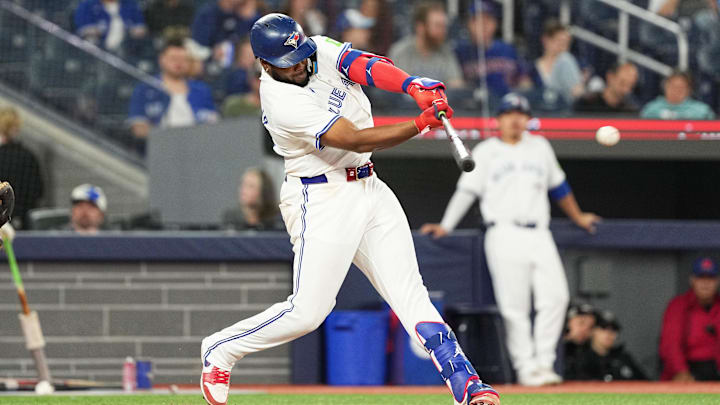 Sep 27, 2024; Toronto, Ontario, CAN; Toronto Blue Jays first baseman Vladimir Guerrero Jr. (27) hits a single against the Miami Marlins during the eighth inning at Rogers Centre.
