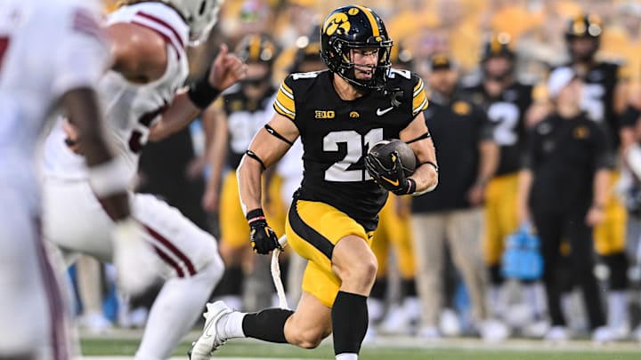 Sep 13, 2025; Iowa City, Iowa, USA; Iowa Hawkeyes wide receiver Kaden Wetjen (21) runs for a touchdown during the first quarter against the Massachusetts Minutemen at Kinnick Stadium. Mandatory Credit: Jeffrey Becker-Imagn Images