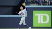 Oct 25, 2025; Toronto, Ontario, CAN; Los Angeles Dodgers shortstop Mookie Betts (50) makes a catch against Toronto Blue Jays center fielder Daulton Varsho (5) in the sixth inning during game two of the 2025 MLB World Series at Rogers Centre. Mandatory Credit: John E. Sokolowski-Imagn Images