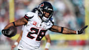 Dec 1, 2024; Jacksonville, Florida, USA; Houston Texans running back Joe Mixon (28) runs with the ball against the Jacksonville Jaguars in the second quarter at EverBank Stadium. Mandatory Credit: Nathan Ray Seebeck-Imagn Images