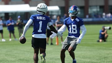 Jul 24, 2025; East Rutherford, NJ, USA; New York Giants wide receiver Malik Nabers (1) and New York Giants wide receiver Darius Slayton (18) celebrate during training camp at Quest Diagnostics Training Center. Mandatory Credit: Vincent Carchietta-Imagn Images