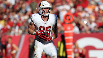 Nov 30, 2025; Tampa, Florida, USA; Arizona Cardinals tight end Trey McBride (85) catches a touchdown during the second half against the Tampa Bay Buccaneers at Raymond James Stadium. Mandatory Credit: Nathan Ray Seebeck-Imagn Images