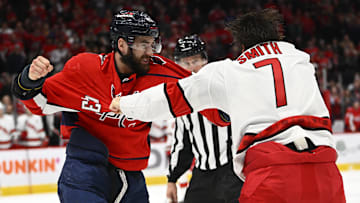 Mar 28, 2022; Washington, District of Columbia, USA; Washington Capitals right wing Tom Wilson (43) and Carolina Hurricanes defenseman Brendan Smith (7) fight during the third period at Capital One Arena. Mandatory Credit: Brad Mills-Imagn Images