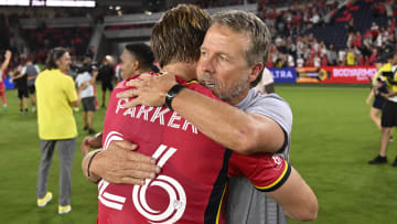 Jul 3, 2024; St. Louis, Missouri, USA; St. Louis CITY SC defender Tim Parker (26) celebrates with St. Louis CITY SC interim head coach John Hackworth after beating the San Jose Earthquakes 2-0 at CITYPARK. Mandatory Credit: Joe Puetz-USA TODAY Sports