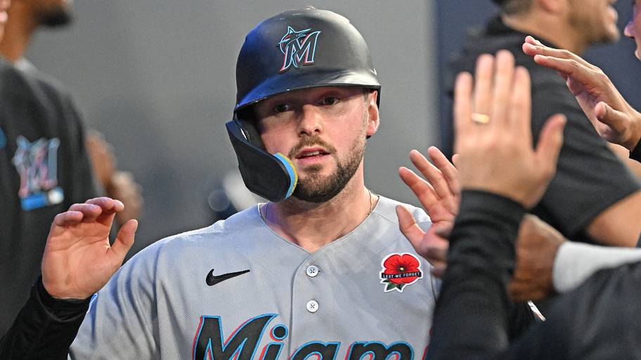 Miami Marlins first baseman Liam Hicks celebrates in the dugout