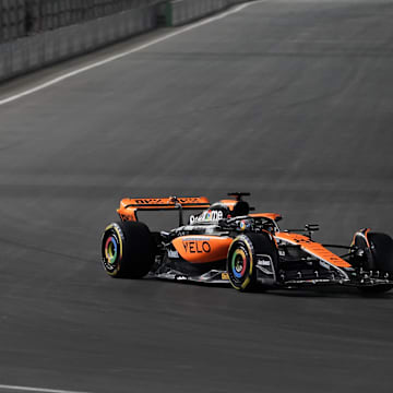 Nov 17, 2023; Las Vegas, Nevada, USA;  McLaren F1 drivers Lando Norris (4) of Great Britain and Oscar Piastri (81) of Australia drive during practice 3 at the Las Vegas Strip Circuit. Mandatory Credit: Lucas Peltier-Imagn Images