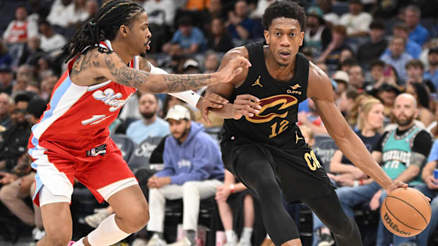 De'Andre Hunter (12) moves past his defender Memphis Grizzlies point guard Ja Morant (12)