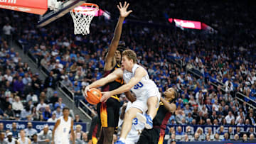 Dallin Hall swings a dish across the court.