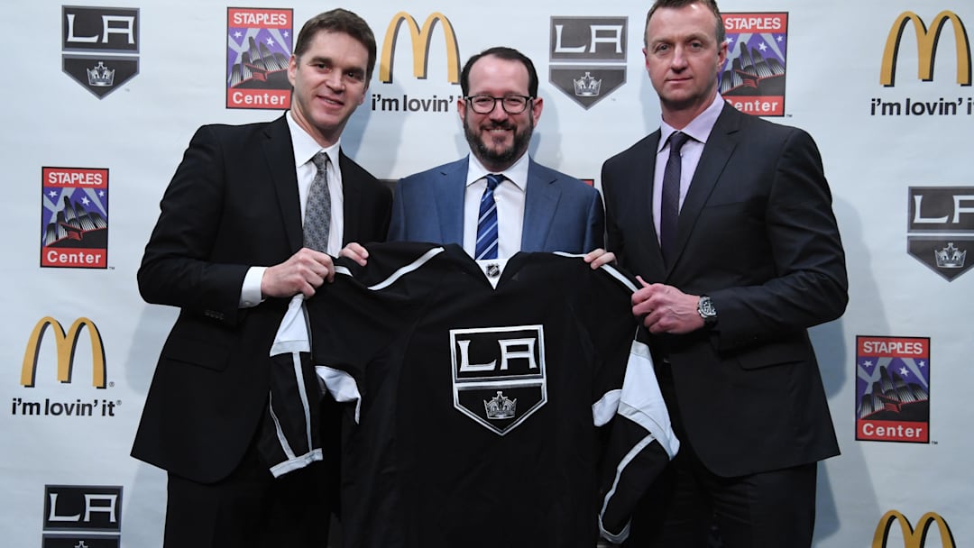 Apr 11, 2017; Los Angeles, CA, USA; Los Angeles Kings president Luc Robitaille (left), AEG president Dan Beckerman (center) and Kings general manager Rob Blake pose with a Kings jersey during press conference at the Staples Center. Mandatory Credit: Kirby Lee-Imagn Images