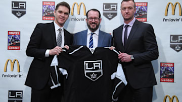 Apr 11, 2017; Los Angeles, CA, USA; Los Angeles Kings president Luc Robitaille (left), AEG president Dan Beckerman (center) and Kings general manager Rob Blake pose with a Kings jersey during press conference at the Staples Center. Mandatory Credit: Kirby Lee-Imagn Images