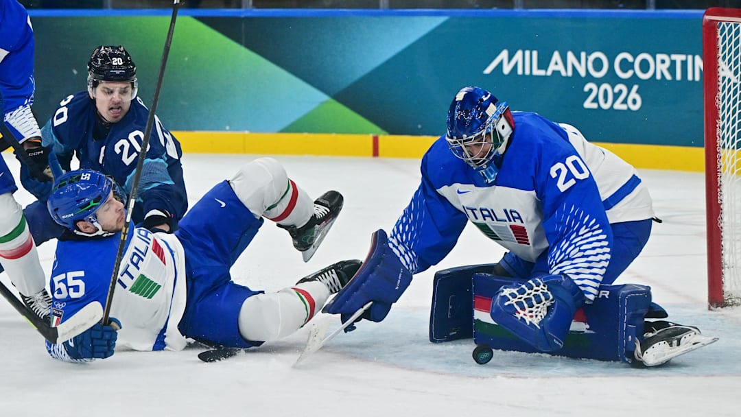 [US, Mexico & Canada customers only] Feb 14, 2026; Milan, Italy;  Damian Clara of Italy and Luca Zanatta of Italy in action with Sebastian Aho of Finland in men's ice hockey Group B play during the Milano Cortina 2026 Olympic Winter Games at Milano Santagiulia Ice Hockey Arena. Mandatory Credit: Marton Monus/Reuters via Imagn Images