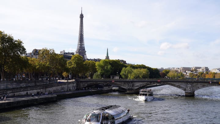 Oct 22, 2022; Paris, FRANCE;  General view the Eiffel Tower and the Seine river, as seen from Pont Alexandre III in advance of the Paris 2024 Summer Olympic Games. The bridge will serve as the site for triathlon, open water swim and road cycling. Mandatory Credit: Jerry Lai-USA TODAY Sports