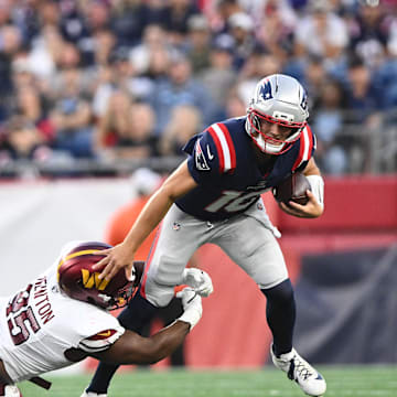 Aug 8, 2025; Foxborough, Massachusetts, USA; Washington Commanders safety Dominique Hampton (45) tackles New England Patriots quarterback Drake Maye (10) during the first half at Gillette Stadium. Mandatory Credit: Brian Fluharty-Imagn Images