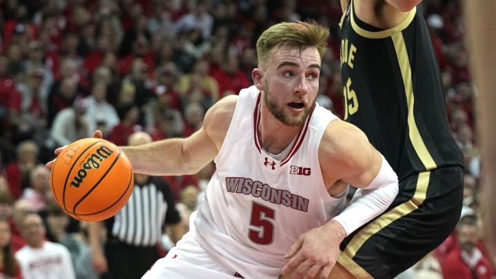 Feb 4, 2024; Madison, Wisconsin, USA; Wisconsin forward Tyler Wahl (5) drives around Purdue center Zach Edey (15) during the second half at Kohl Center. Mandatory Credit: Mark Hoffman-USA TODAY Sports Feb 4, 2024; Madison, Wisconsin, USA; Wisconsin forward Tyler Wahl (5) drives around Purdue center Zach Edey (15) during the second half at Kohl Center. Mandatory Credit: Mark Hoffman-USA TODAY Sports