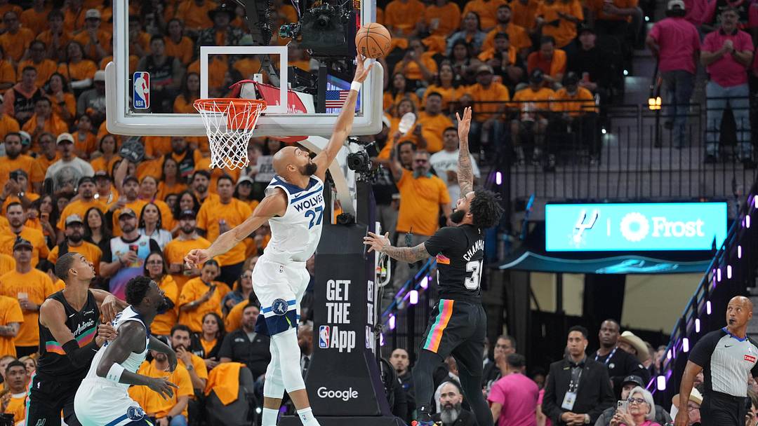 May 4, 2026; San Antonio, Texas, USA; Minnesota Timberwolves center Rudy Gobert (27) blocks a shot by San Antonio Spurs forward Julian Champagnie (30) in the first half during game one of the second round of the 2026 NBA Playoffs at Frost Bank Center. Mandatory Credit: Daniel Dunn-Imagn Images