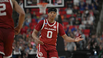 Mar 21, 2025; Raleigh, NC, USA;  Oklahoma Sooners guard Jeremiah Fears (0) reacts after scoring against Connecticut Huskies during the second half at Lenovo Center. Mandatory Credit: Zachary Taft-Imagn Images