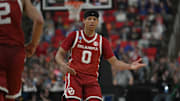 Mar 21, 2025; Raleigh, NC, USA;  Oklahoma Sooners guard Jeremiah Fears (0) reacts after scoring against UConn during the second half at Lenovo Center. Mandatory Credit: Zachary Taft-Imagn Images