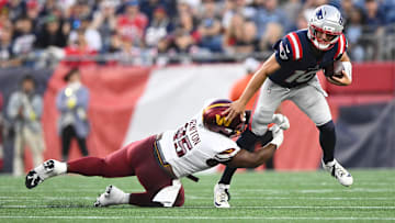 Aug 8, 2025; Foxborough, Massachusetts, USA; Washington Commanders safety Dominique Hampton (45) tackles New England Patriots quarterback Drake Maye (10) during the first half at Gillette Stadium. Mandatory Credit: Brian Fluharty-Imagn Images