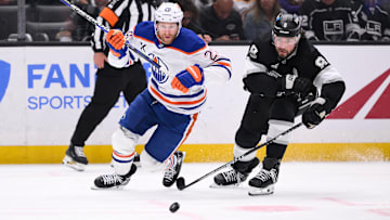 Apr 5, 2025; Los Angeles, California, USA; Edmonton Oilers right wing Connor Brown (28) and Los Angeles Kings defenseman Drew Doughty (8) during an NHL game at Crypto.com Arena. Mandatory Credit: Robert Hanashiro-Imagn Images