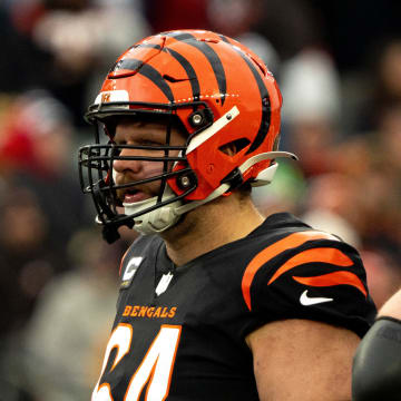 Cincinnati Bengals center Ted Karras (64) stands with other offensive lineman during the NFL game between Cincinnati Bengals and Cleveland Browns at Paycor Stadium in Cincinnati on Sunday, Jan. 7, 2024.