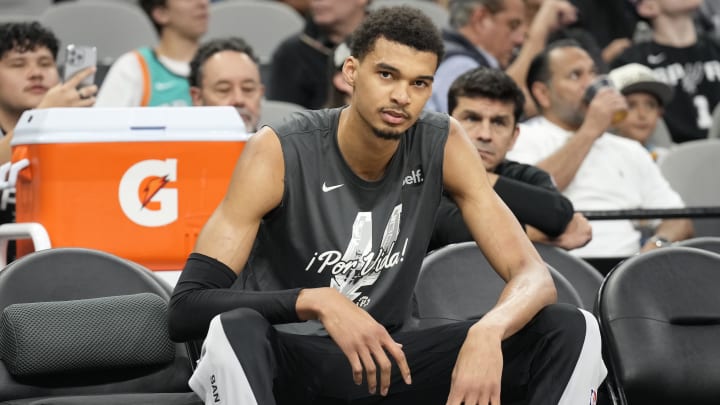 Mar 29, 2024; San Antonio, Texas, USA; San Antonio Spurs forward Victor Wembanyama (1) sits on the bench before the game against the New York Knicks at Frost Bank Center. 