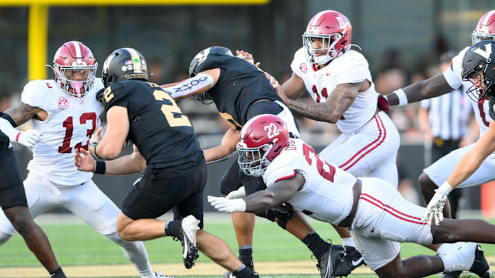 Moore, No. 13, had 10 tackles against the Commodores Moore, No. 13, had 10 tackles against the Commodores
