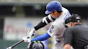 Los Angeles Dodgers designated hitter Shohei Ohtani (17) swings in the first inning against the Colorado Rockies at Coors Field on June 24.