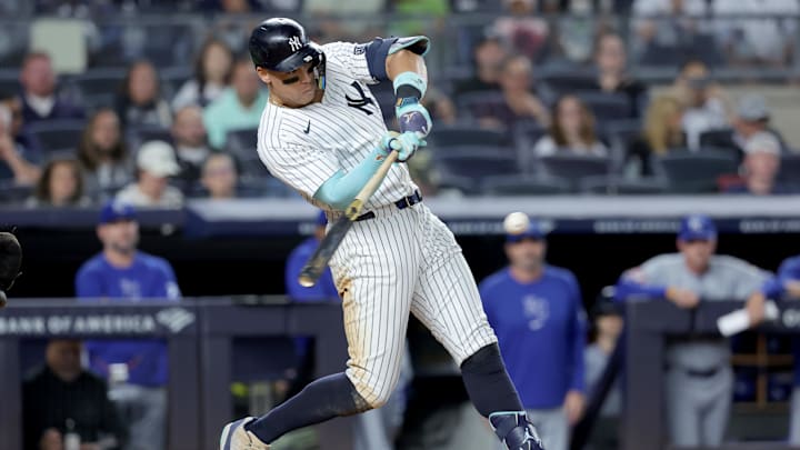 Sep 9, 2024; Bronx, New York, USA; New York Yankees designated hitter Aaron Judge (99) follows through on an RBI single against the Kansas City Royals during the seventh inning at Yankee Stadium. Mandatory Credit: Brad Penner-Imagn Images