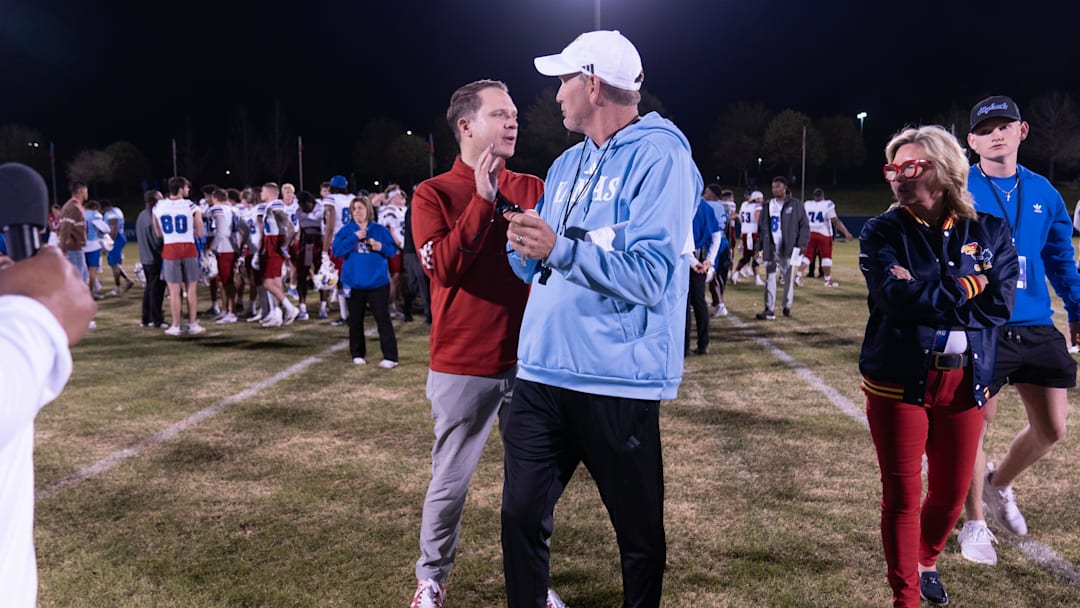 Kansas athletic director Travis Goff talks with coach Lance Leipold following Friday's Spring Preview at Rock Chalk Park.