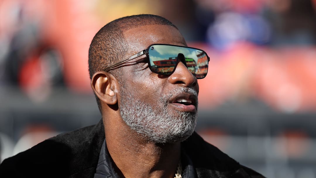 Dec 21, 2025; Cleveland, Ohio, USA;  Legendary  football and baseball player and father of Cleveland Browns quarterback Shedeur Sanders, Deion Sanders on the sidelines prior to a game against the Buffalo Bills at Huntington Bank Field. Mandatory Credit: Scott Galvin-Imagn Images