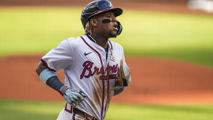 May 20, 2024; Cumberland, Georgia, USA; Atlanta Braves right fielder Ronald Acuna Jr (13) scores a run against the San Diego Padres during the first inning at Truist Park. Mandatory Credit: Dale Zanine-USA TODAY Sports