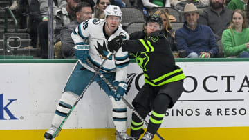 Dec 31, 2022; Dallas, Texas, USA; Dallas Stars center Ty Dellandrea (10) checks San Jose Sharks center Logan Couture (39) during the third period at the American Airlines Center. Mandatory Credit: Jerome Miron-USA TODAY Sports