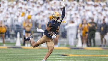 Sep 27, 2025; Morgantown, West Virginia, USA; West Virginia Mountaineers wide receiver Cam Vaughn (4) makes a catch during the first quarter against the Utah Utes at Milan Puskar Stadium. Mandatory Credit: Ben Queen-Imagn Images