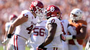 Oklahoma Sooners defensive lineman Taylor Wein (44) and Oklahoma Sooners defensive lineman David Stone (0) celebrate a play in the first half of the Red River Rivalry college football game between the University of Oklahoma Sooners and the Texas Longhorn at the Cotton Bowl Stadium in Dallas, Texas, Saturday, Oct. 11, 2025.