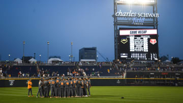 Tennessee huddles in the outfield after the NCAA College World Series game between Tennessee and LSU held at Charles Schwab Field in Omaha, Nebraska, Tuesday, June 20, 2023. LSU defeated Tennessee.